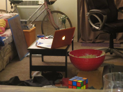 Bowl full of cookie dough on table in living room.