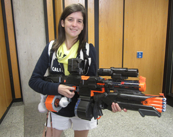 A user with an extremely large blaster that has been painted black.